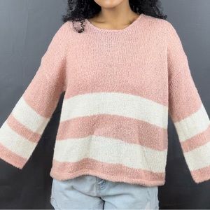 Cute pink sweater in size large.